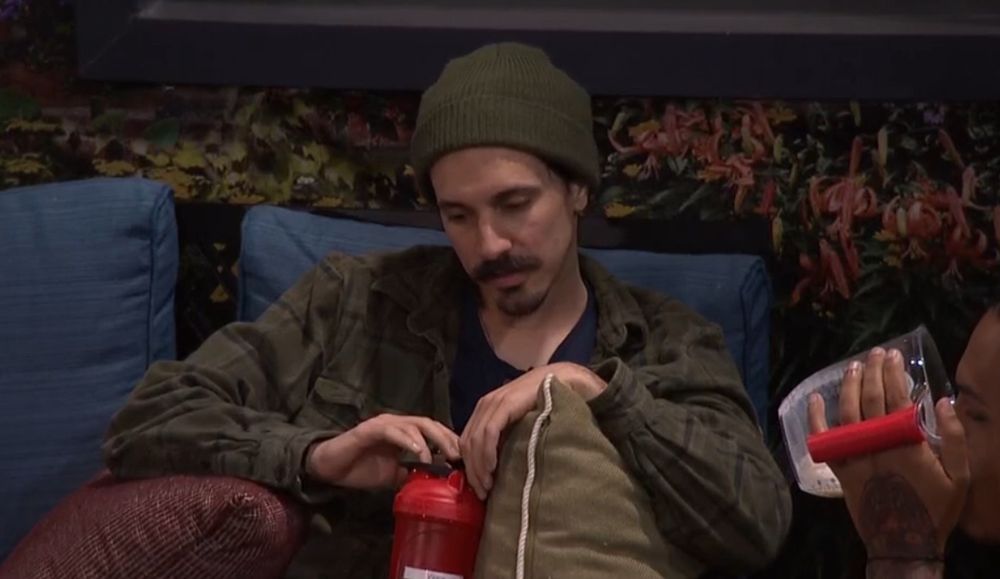 Vinny looking sad... but more importantly, on the side of the frame, Keanu is drinking milk and cereal out of a measuring cup.  It has a handle, bro!