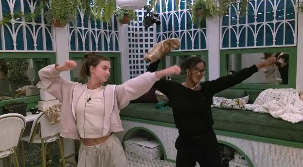 Ashley and Lauren dancing together in the bathroom