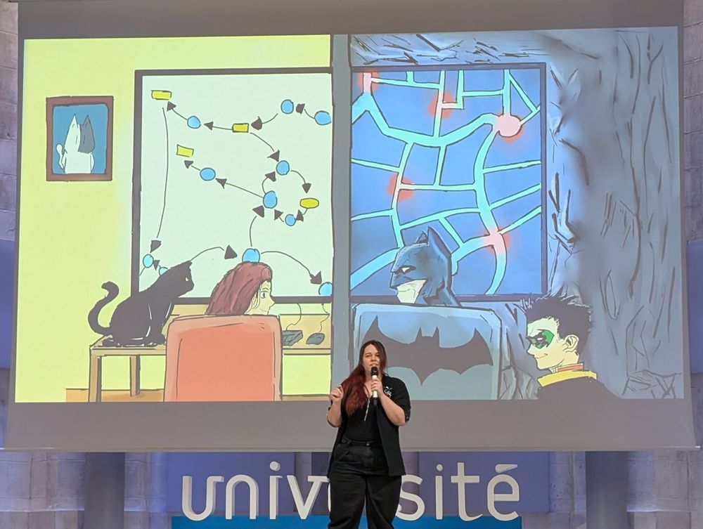 Coralie devant sa slide de présentation divisée en deux, la partie gauche la représentant accompagnée de son chat en train d'étudier une carte du métabolisme 
La partie droite représente Batman et Robin devant une carte des crimes de Gotham
En travaillant ensemble ils vont sauver le monde !