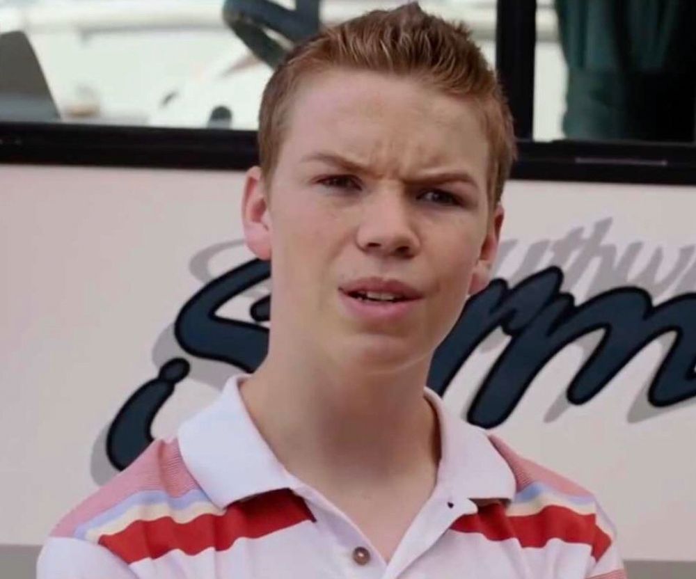 White teenager in a striped polo shirt and a very confused expression.