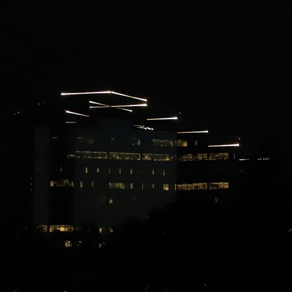 an office building at night, the cover for the vaporwave album "quick connect" by CONFERENCE SOFTWARE