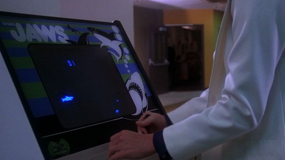 A shot of someone playing the Jaws video game from Piranha.