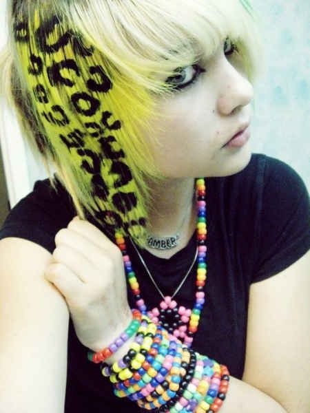 a photo of a scene kid (amberhhhisdead) showing off a freshly dyed strip of hair (yellow with cheetah print painted over)