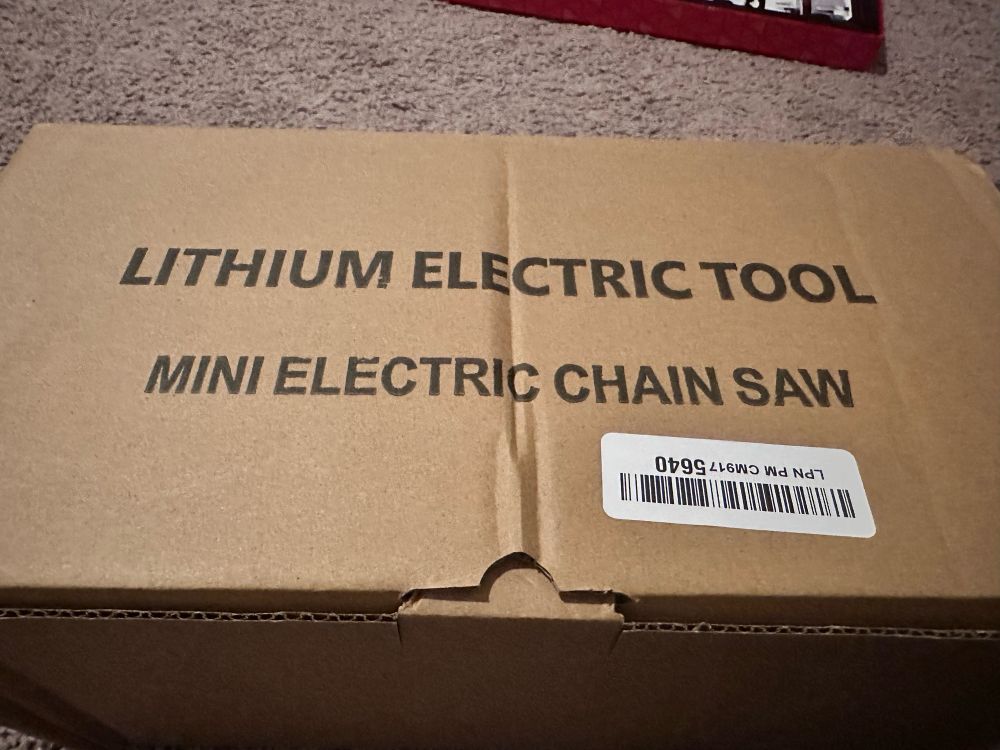 Box reading “Mini Electric Chain Saw”