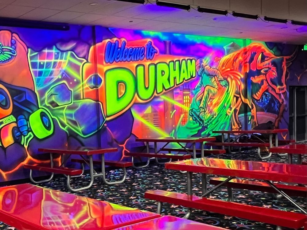 Neon Durham mural at Wheels 