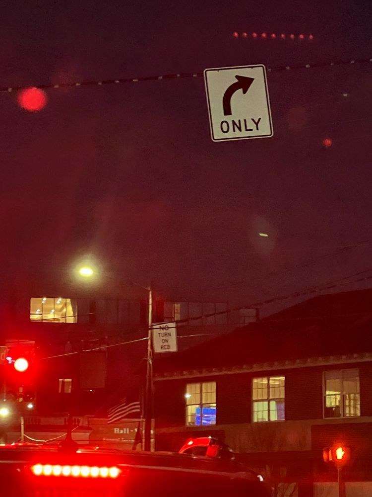 Photo taken from passenger seat while waiting at a red light.  Right turn only sign needed to be removed. 