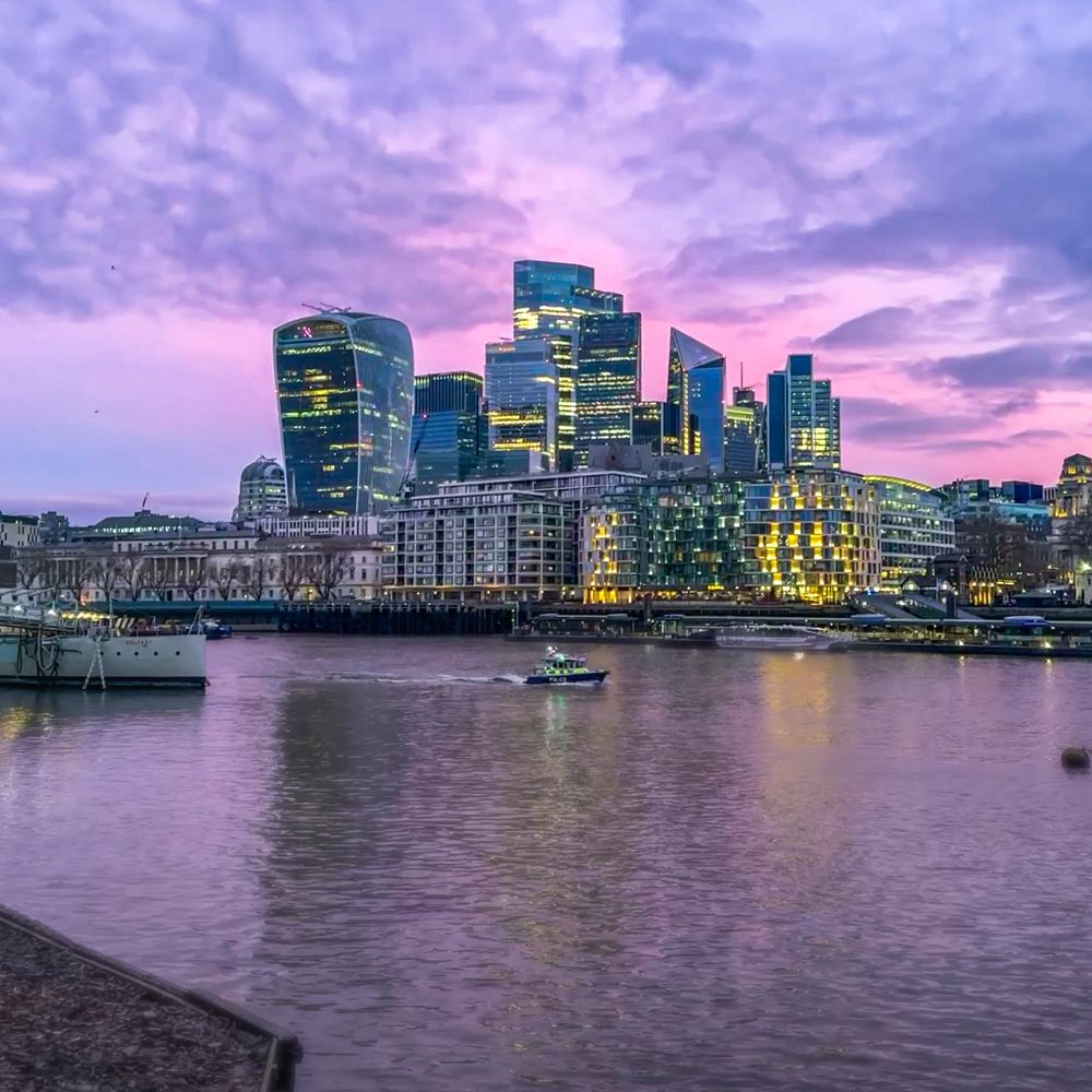 London at titting sillyoclock looking pinkish today. A police boat is about to ruin the nice calm Thames  