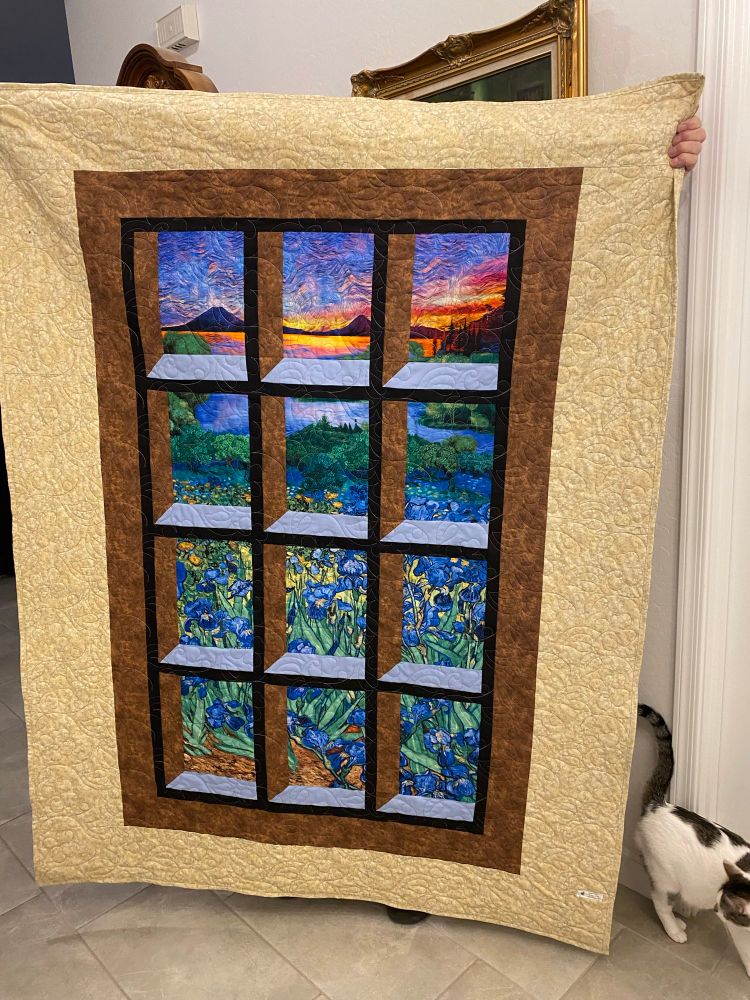 Landscape of mountains and irises as viewed from a window. 