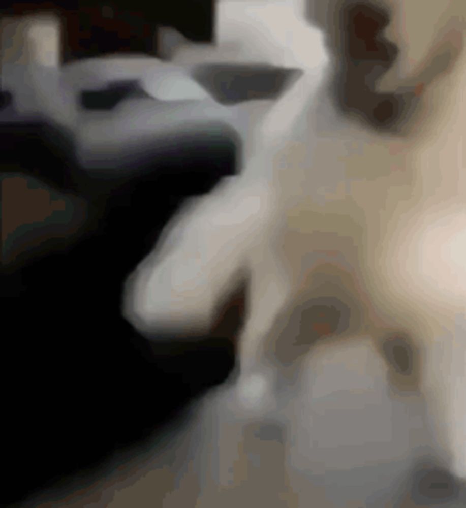 a blurred image of a person 's face with a black background