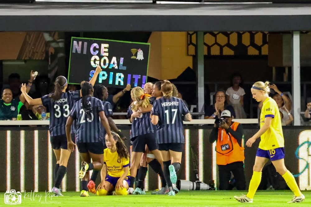 The Spirit celebrate their tying goal at the end of 13 minutes of second half stoppage time. Defender Casey Krueger (second Spirit player from right) put in a header on a Tara McKeown (third from right) cross in the 112th minute.