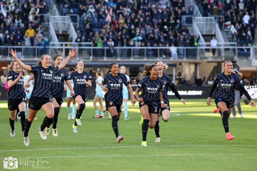 The Spirit players celebrate their win.