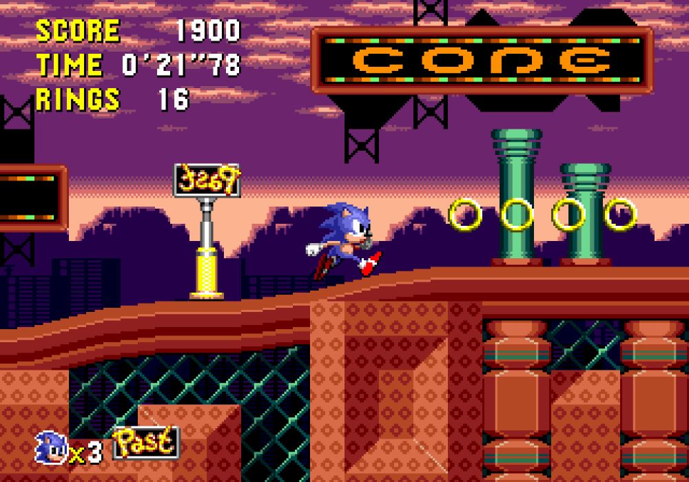 A mockup screenshot of a Sonic CD styled version of Spring Yard Zone. Sonic is walking up a slope towards some rings. Behind him is a "PAST" sign, which he has flipped. Above him is a large neon sign similar to those found in Collision Chaos, reading "COPE".
