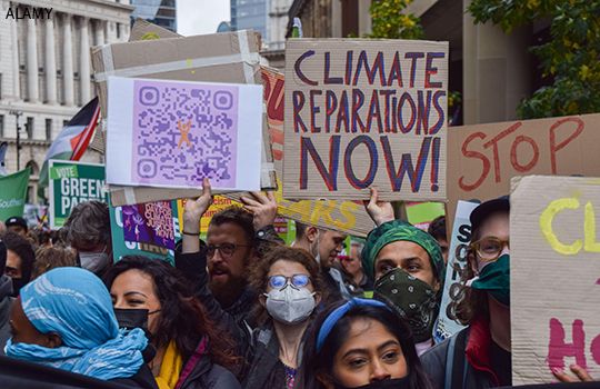 People protest calling for climate reparations