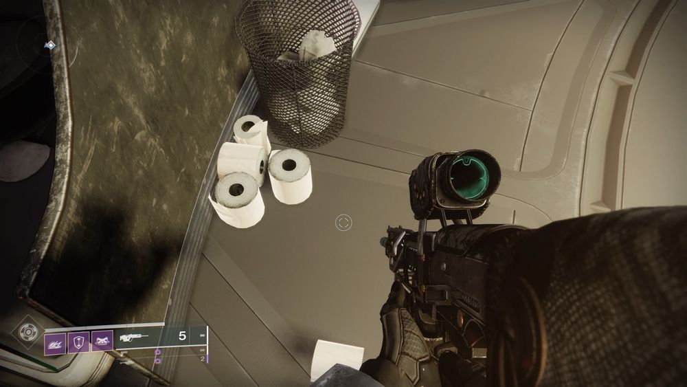 Five full rolls of toilet paper next to a waste paper basket in a bathroom at The Tower in Destiny 2.