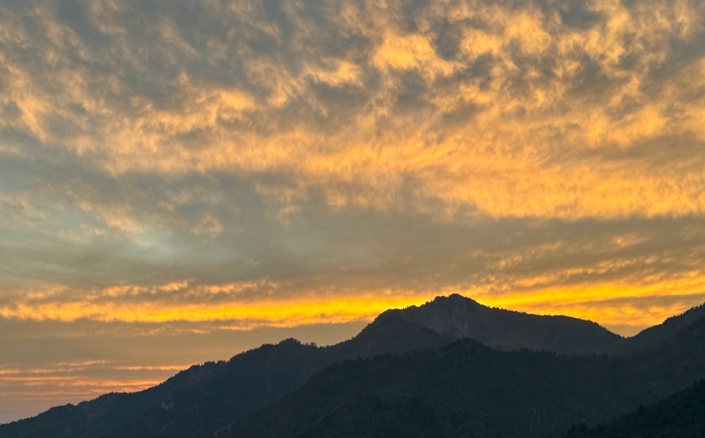 Sunset clouds over a mountain range 