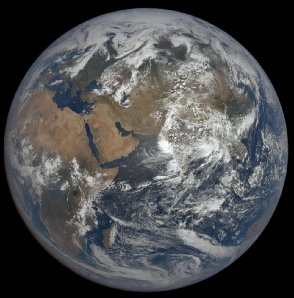 A full-disc view of Earth in space, centered on the Indian Ocean. Brown continents, blue seas, and swirling white clouds. seen yesterday by NASA's EPIC camera aboard NOAA's DSCOVR satellite
