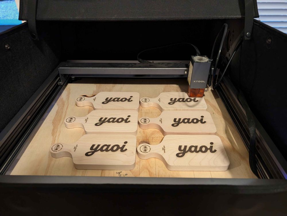 a lot of yaoi paddles being engraved