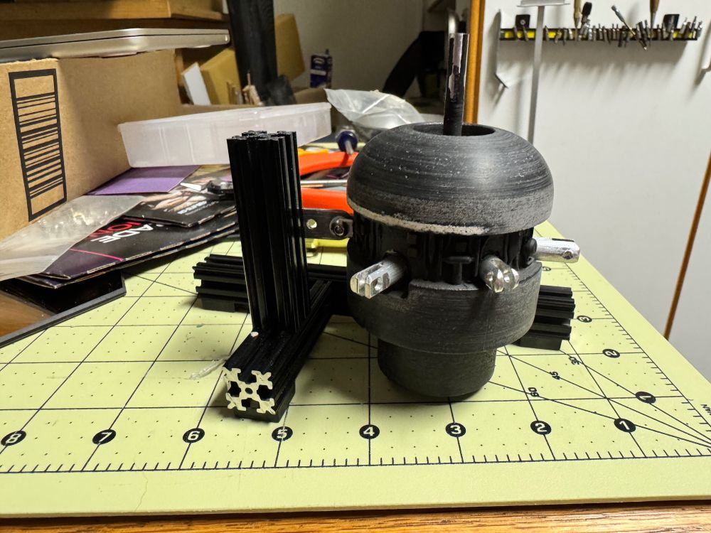 The aft cowling locked into the alignment jig, with epoxied pins curing