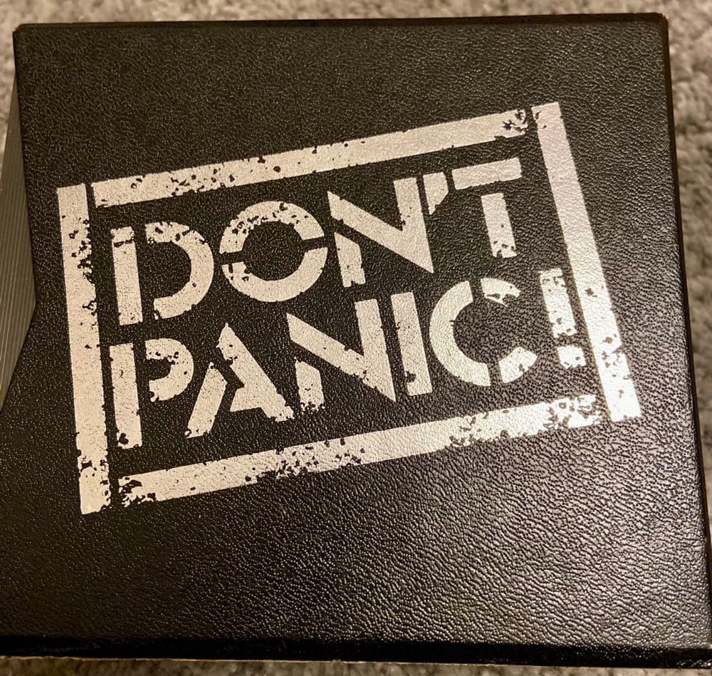 “DON’T PANIC” in large friendly letters on the side of the CD box set.