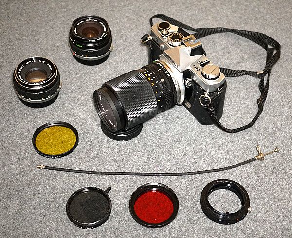 Olympus OM-1 with lenses and filters. 