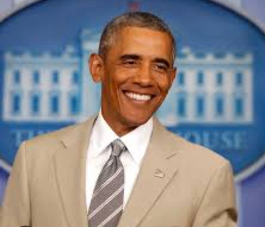 Photo of a smiling President Obama in his tan suit. 
