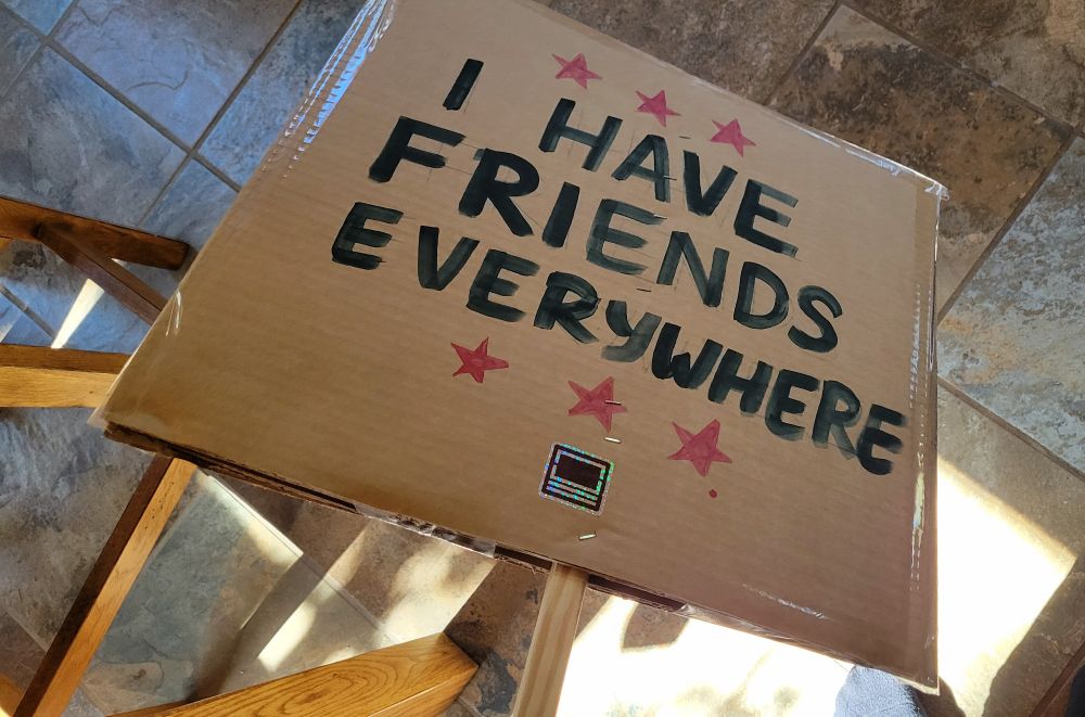 Back of sign: I have friends everywhere (with a little "daughters of ferrix" sticker)