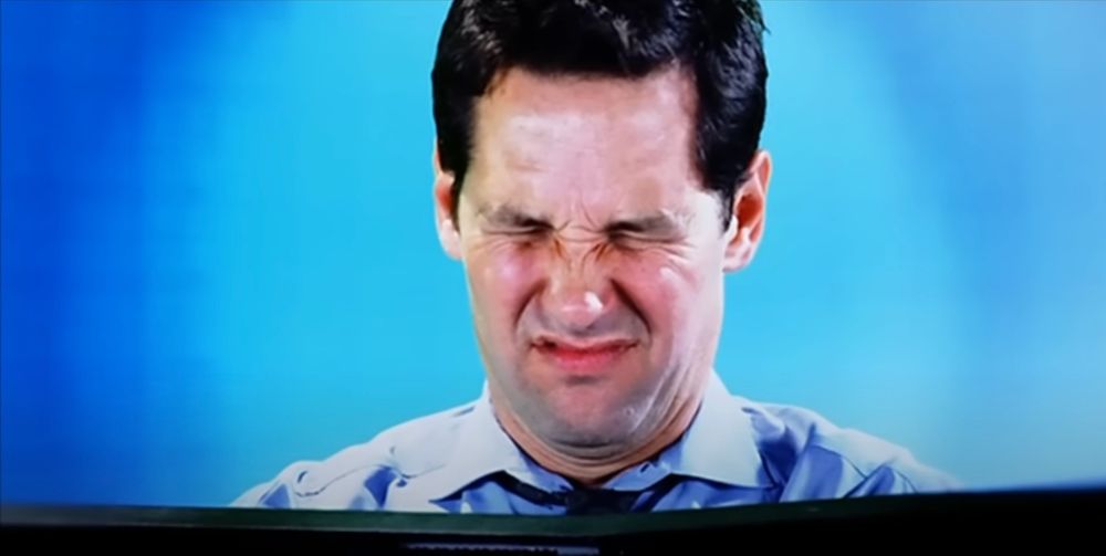 paul rudd squinching his eyes shut in horror after seeing 