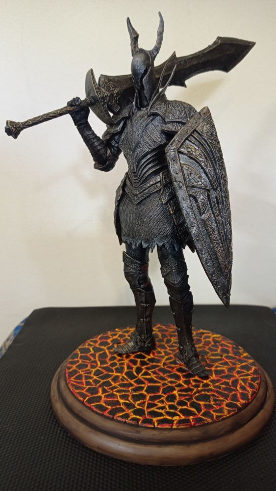 A black Knight standing on cracked lava base