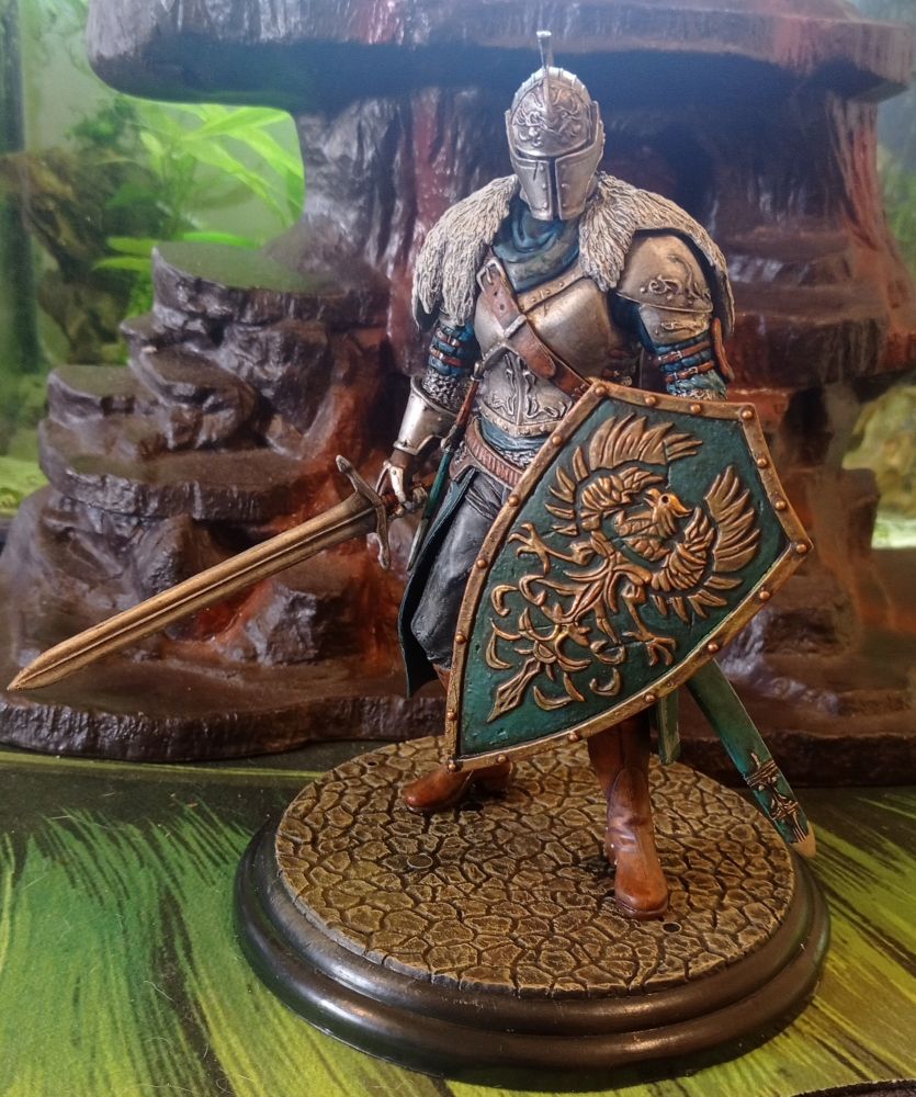A knight with a eagle shield and sword
