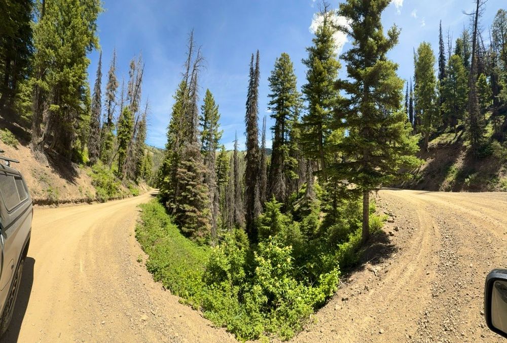 Hairpin curve on dirt road in mountains 
