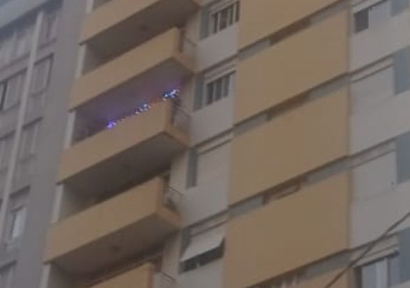 zoom of christmas lights on a balcony