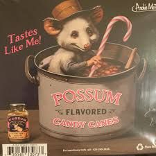 Image of possum in stew pot with beans stirring it with a candy cane and a text bubble saying "Tastes like me!"