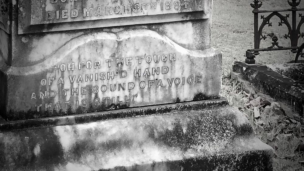 An inscription on a headstone in Toowong Cemetery reads, "Oh for the touch of a vanish'd hand and the sound of a voice that is still".