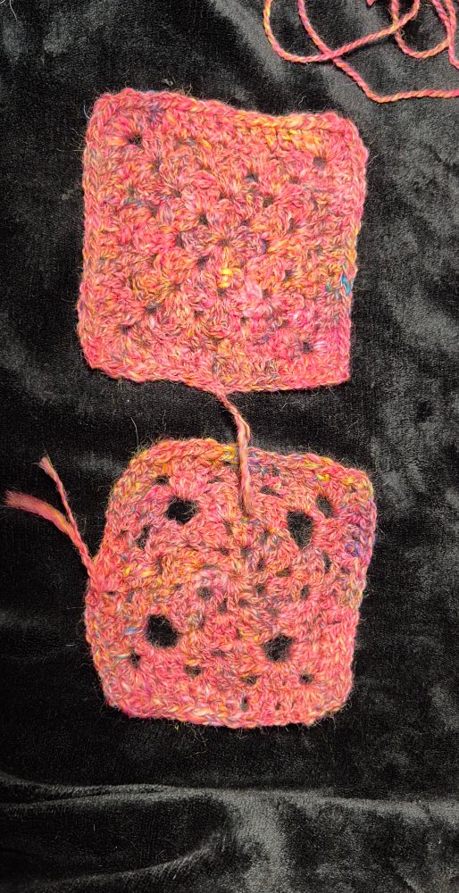 Two handspun pink crochet motifs. The motifs are crocheted in two different granny square patterns. All set against a black background.