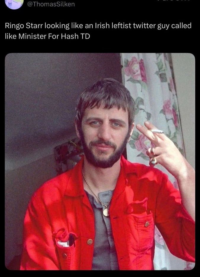 @thomassilken post with a picture of ringo smoking. He has a red shirt on. It’s open over a button up no collar. He has a beard. His hair is clean but I combed. He’s in front of a floral drape on a window. The caption reads “Ringo Starr looking like an Irish leftist twitter guy called like Minister For Hash TD”