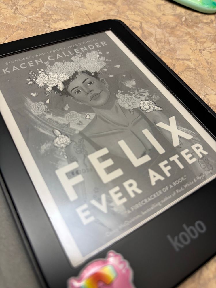 The cover of FELIX EVER AFTER shows one of the self-portraits of protagonist Felix, where he imagines his Black body surrounded by flowers. 