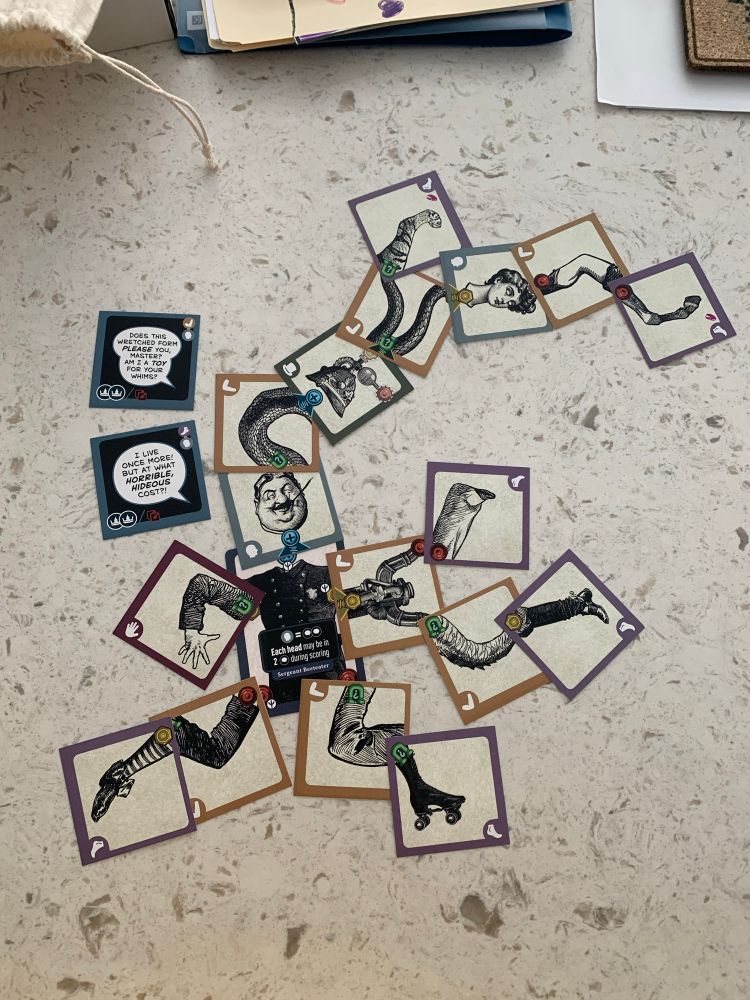 A demonstration of the game in progress with a bunch of body parts connected to a monstrous creature