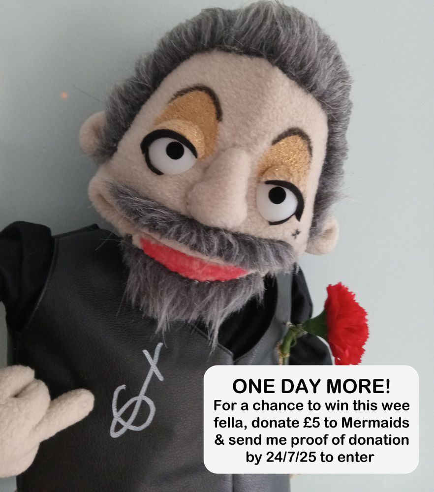 photograph of the signed Izzy Hands muppet flipping the bird. There is a white panel on the bottom right of the image, with black text that reads ONE DAY MORE! For a chance to win this wee fella, donate £5 to Mermaids and send me proof of donation by 24/7/25 to enter.
