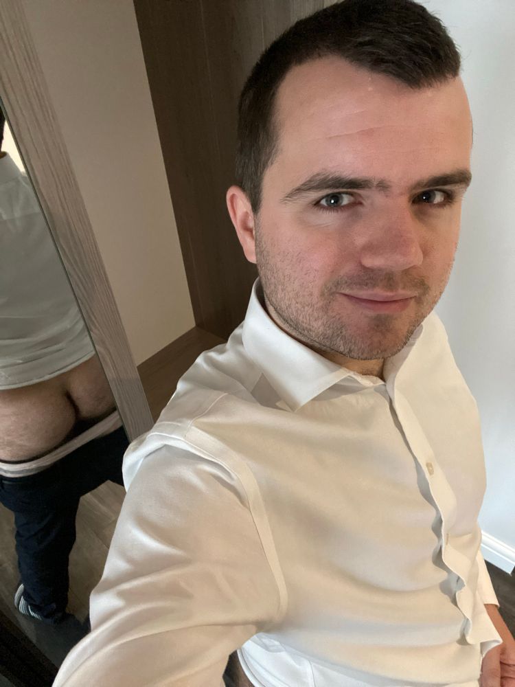 Mirror selfie with mirror reflecting the back and exposed butt. 