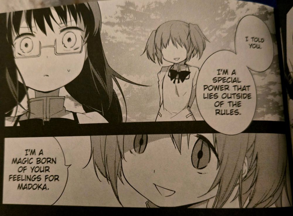 image i took of my physical copy of madoka magica wraith arc book 3 where homura akemi realizes her love for madoka kanemi through wraith madoka