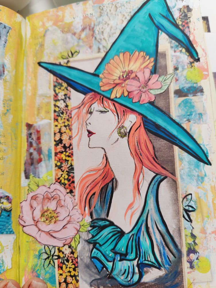 Photo of a book illustration of a 50's era Lady painted over with vibrant colors, flowers, and a bright blue witch hat.