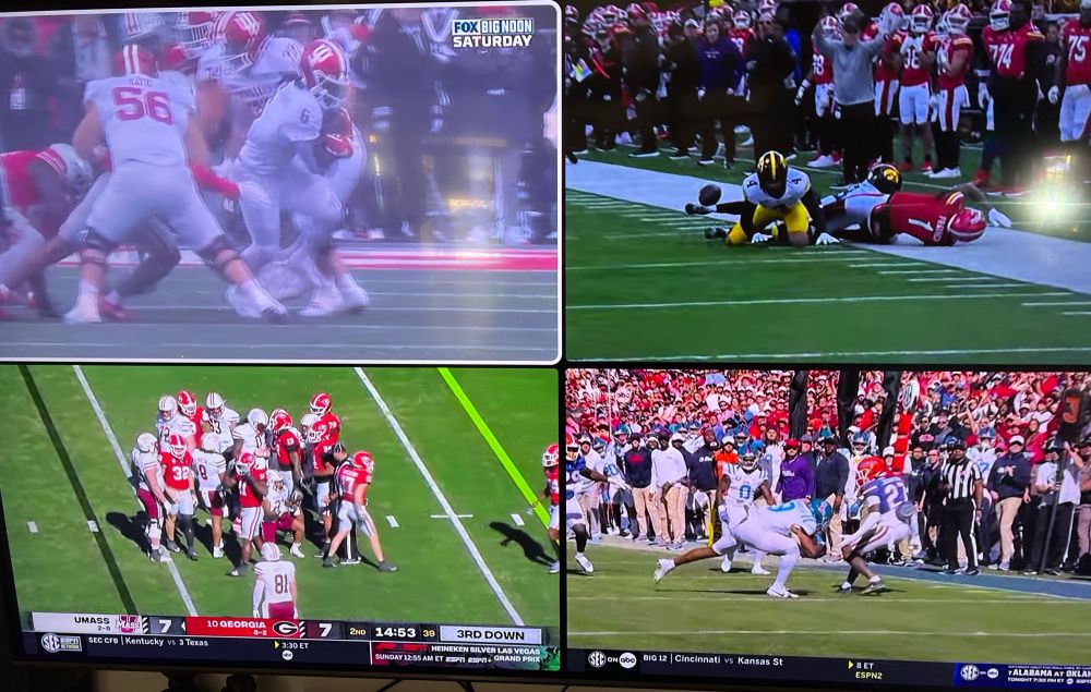 Tv screen with 4 college football games - IU at OSU, Iowa at Maryland, UMass at Georgia, Ole Miss at Florida. 