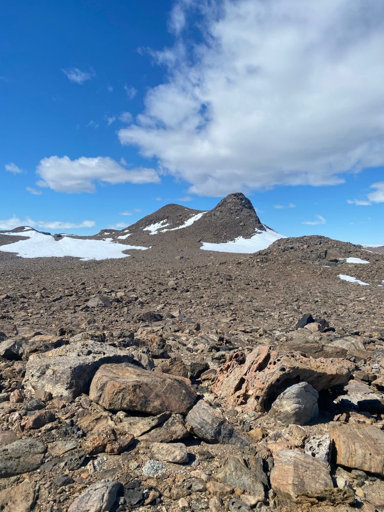 Scattered beautiful rocks with camel hump hill in the background; Bunger Hills Antarctica 