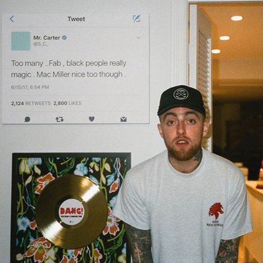 Mac Miller standing in front of a Framed Jay Z tweet 