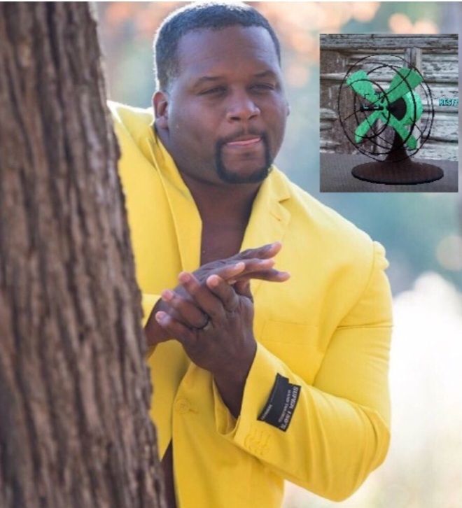 Man behind tree rubbing hands at the prospect of getting a desk fan in the Fallout video game