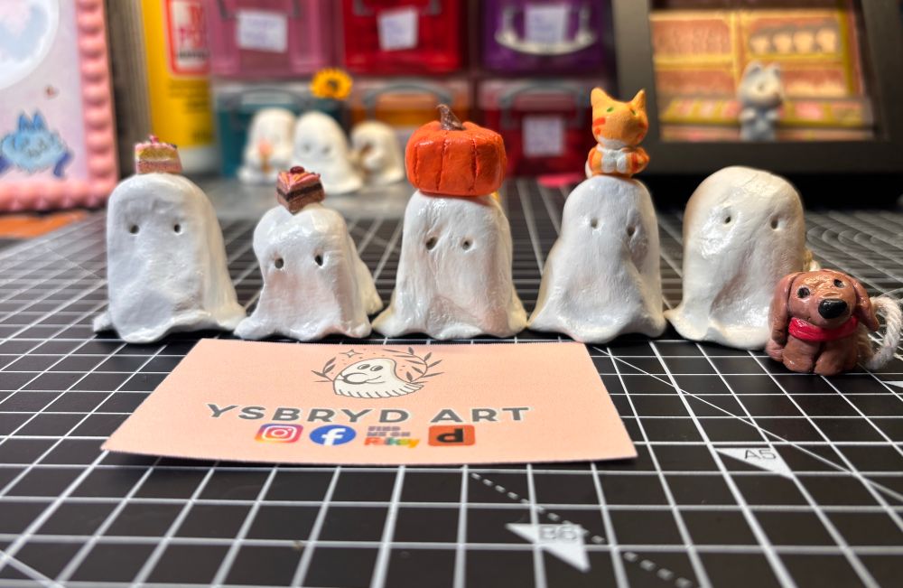 Five of my clay ghosts with various accessories including cake slices, pumpkins, a dog and a cat