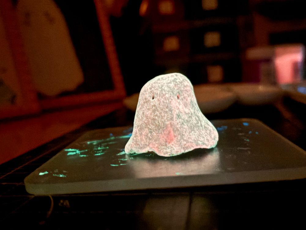 A handmade clay ghost figure which glows white in the dark