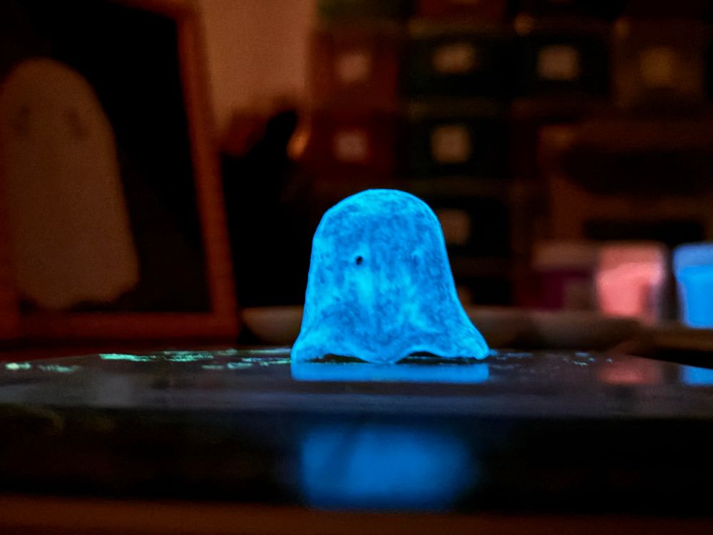 A handmade clay ghost figure which flows blue in the dark