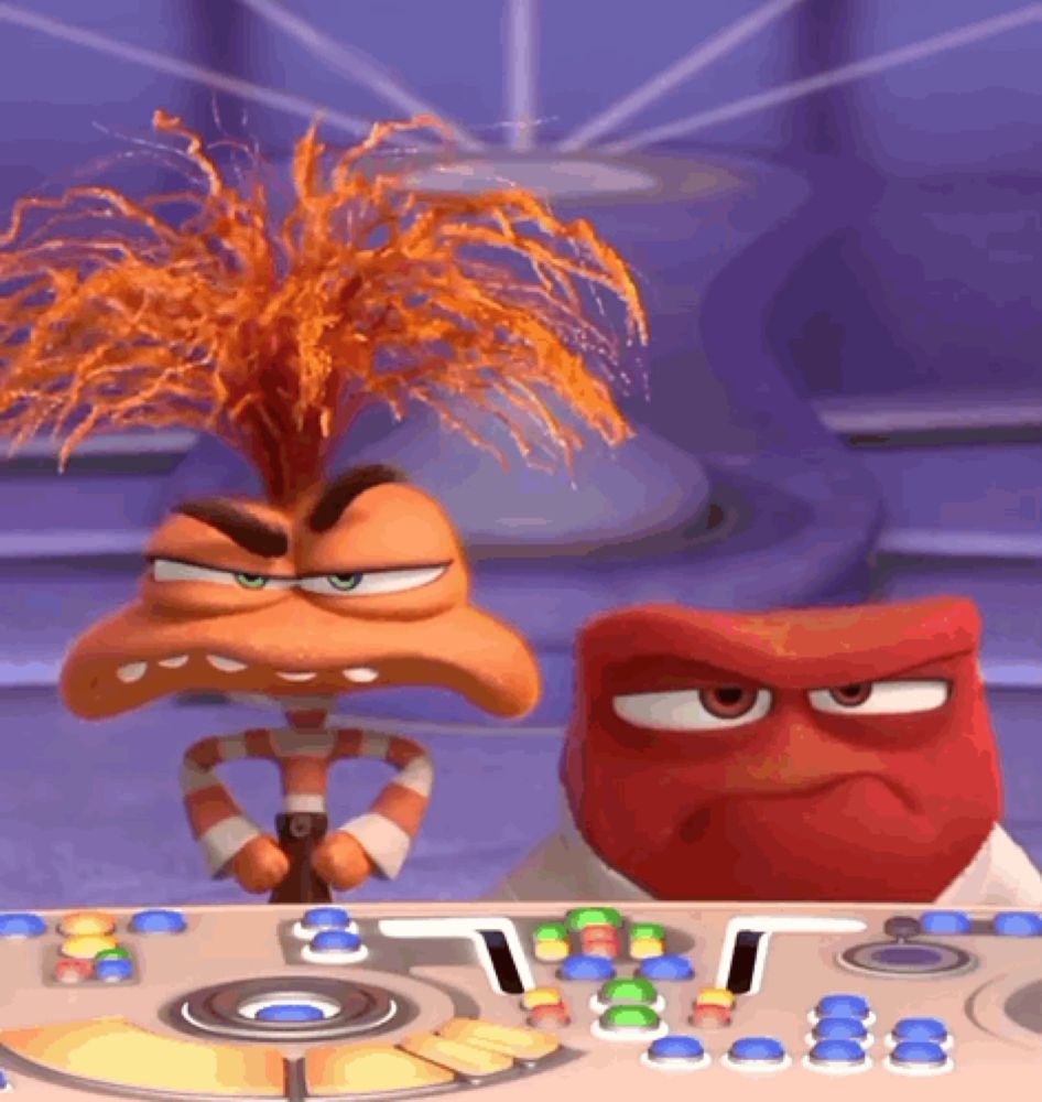 two cartoon characters are sitting at a table with buttons and one has a candy cane in his mouth