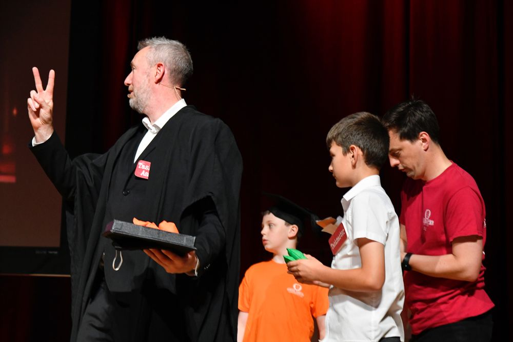 Alex holds up two fingers and accidentally swears...